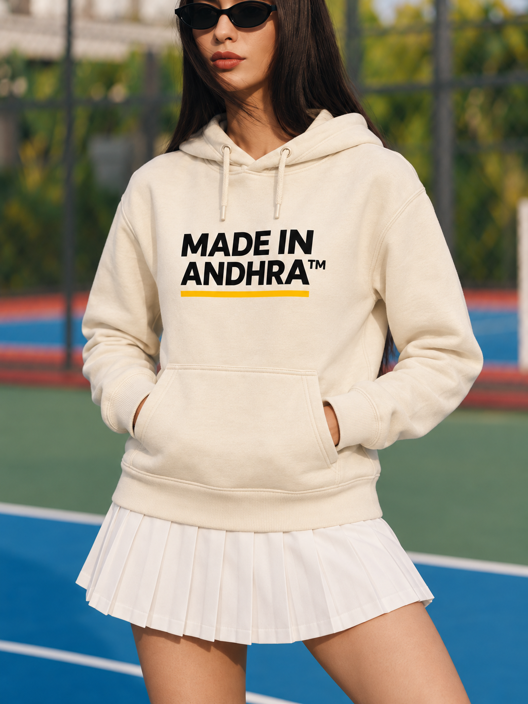 Made in Andhra™ Women's Cream Airport Hoodie — close-up of the chest print, drawstrings and front pouch pocket