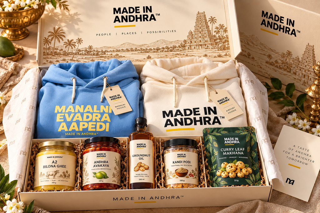 Concept only: MADE IN ANDHRA presentation gift box showcasing the Manalni blue hoodie, women's cream hoodie and Andhra pantry products; bundle contents not included with this individual hoodie.